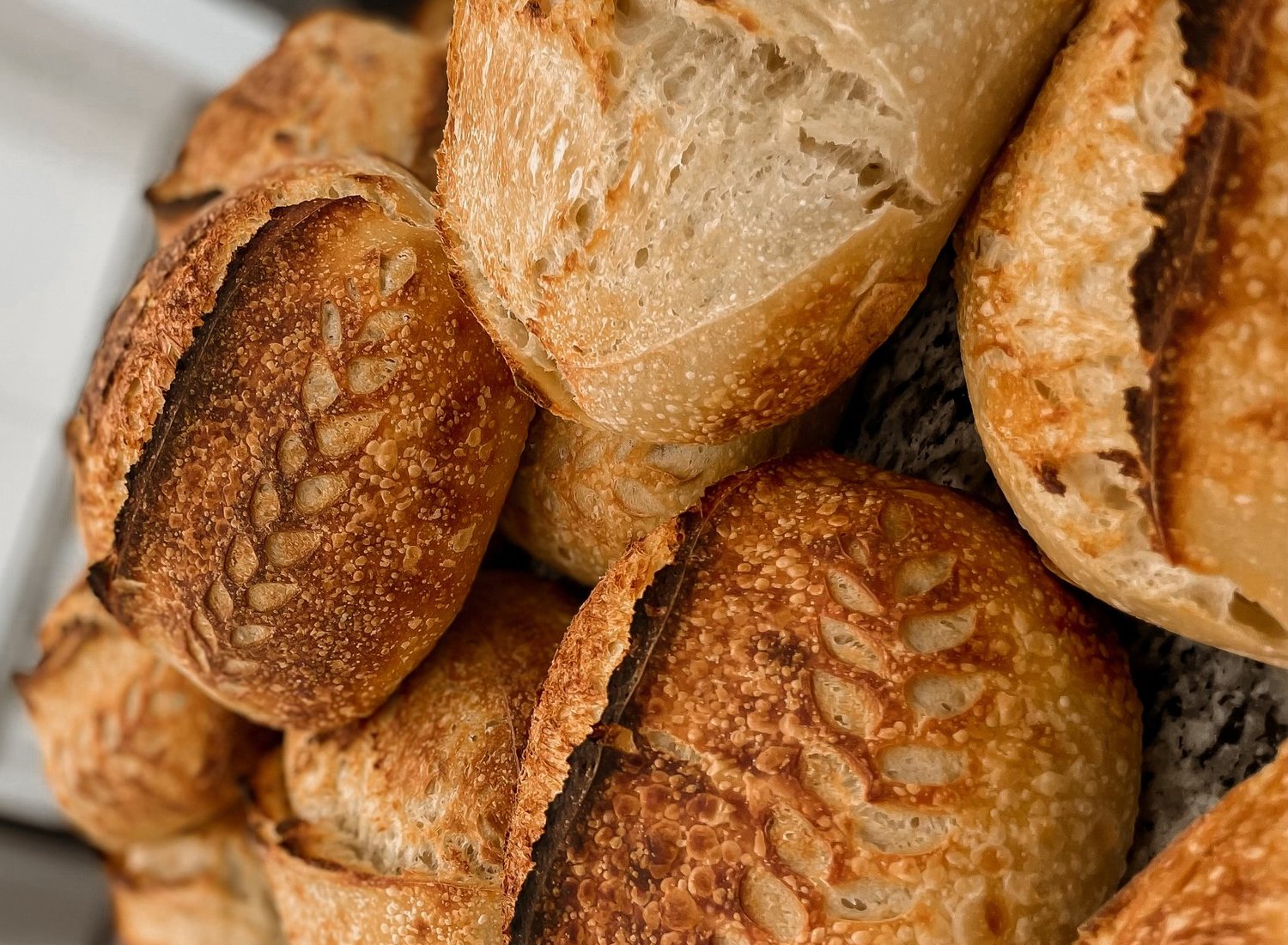 Rustic sourdough loaves on rack